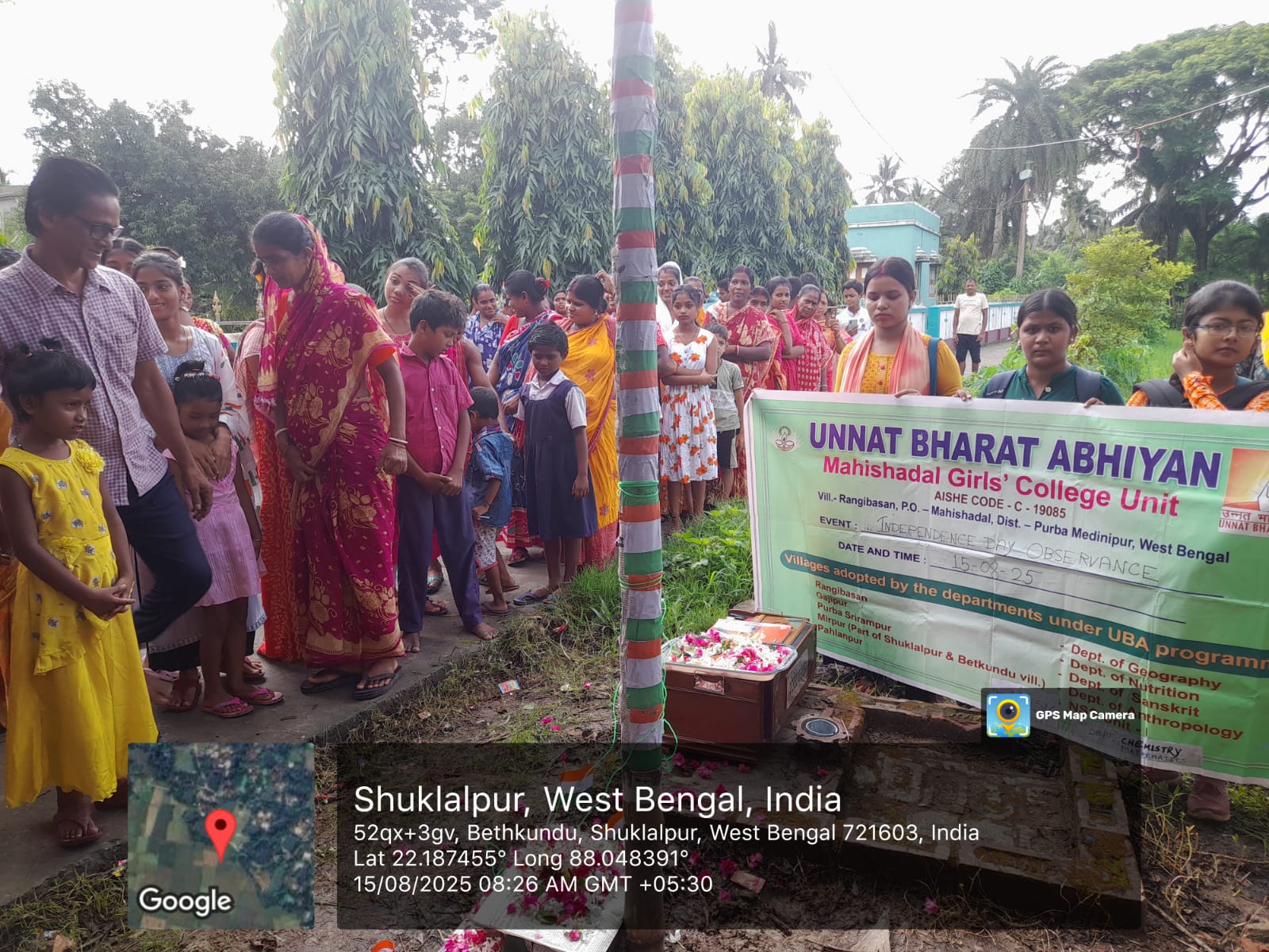 Villagers of Shuklalpur gathered around the flag pole during the UBA observance