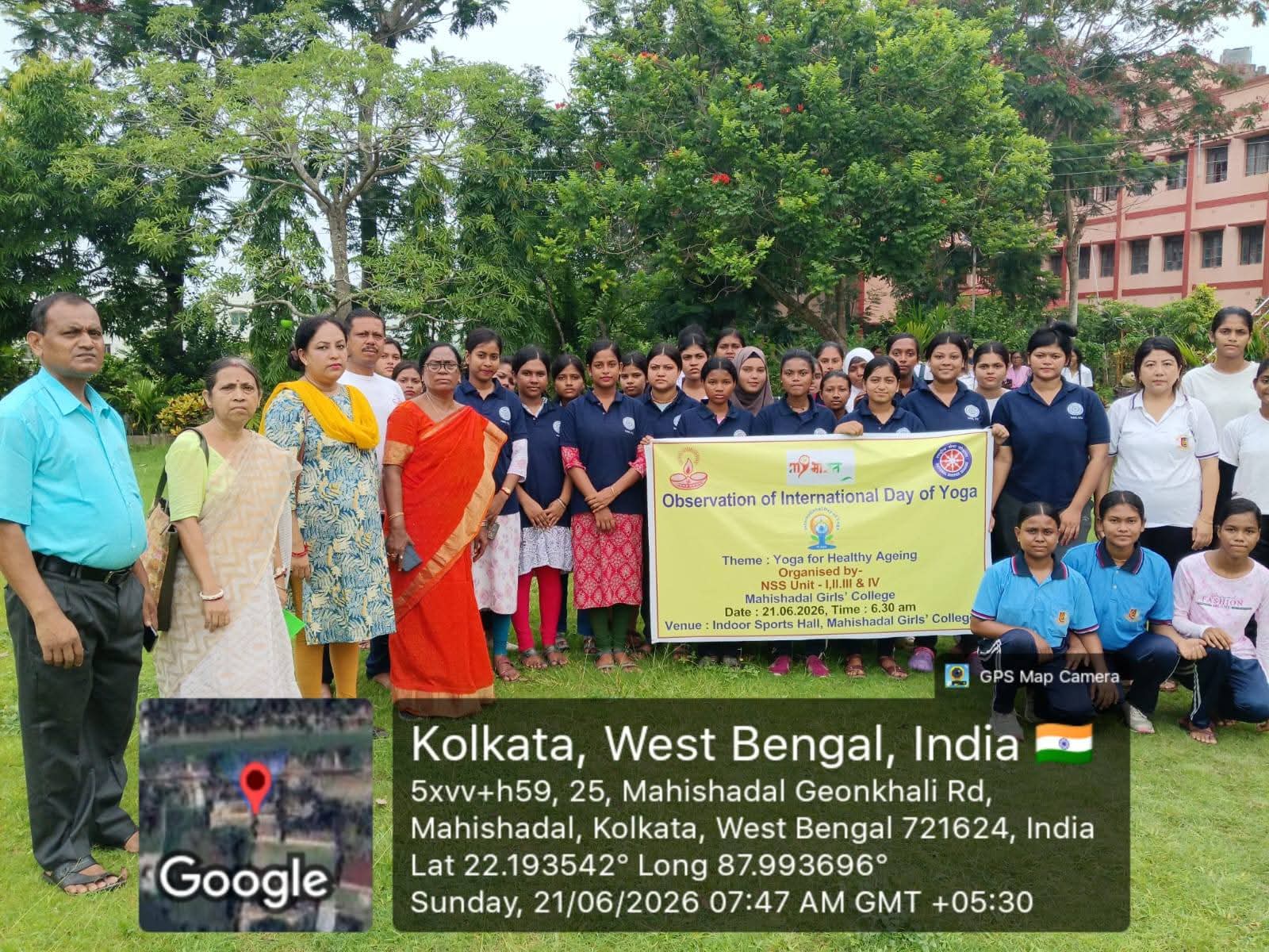 Group photo with International Day of Yoga banner